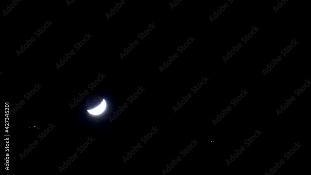 Looking up at a waxing crescent moon and Venus, with an aircraft flying past. Looking up at a waxing crescent moon and Venus, with an aircraft flying past.
