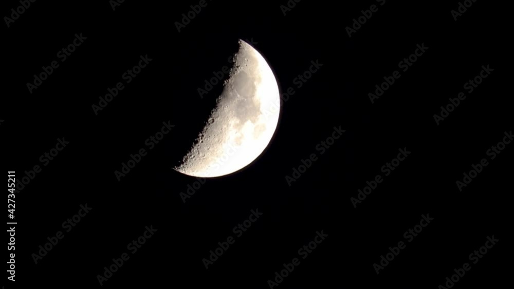 Closeup of quarter moon descending on the screen at night. Closeup of quarter moon descending on the screen at night.