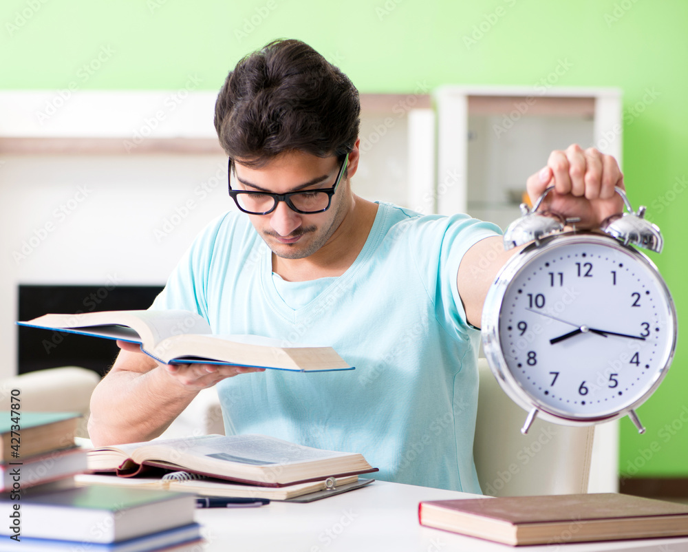 Student preparing for university exams at home in time managemen Student preparing for university exams at home in time managemen