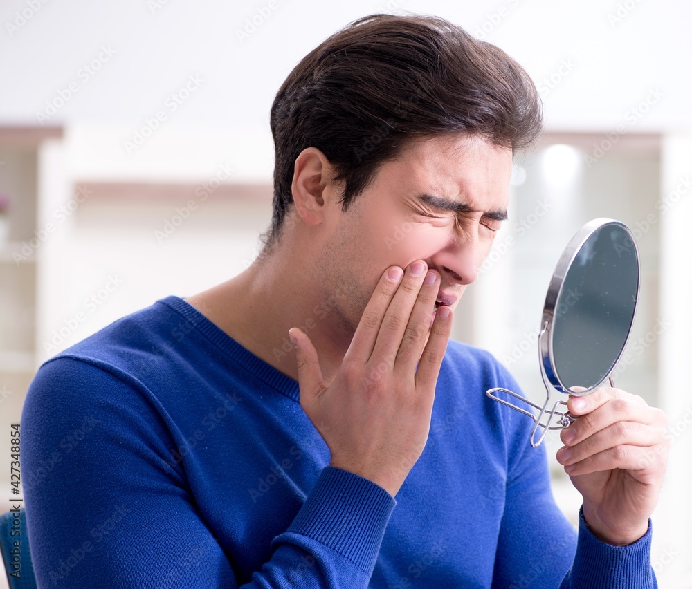 Man panicking because of pimples on the skin Man panicking because of pimples on the skin