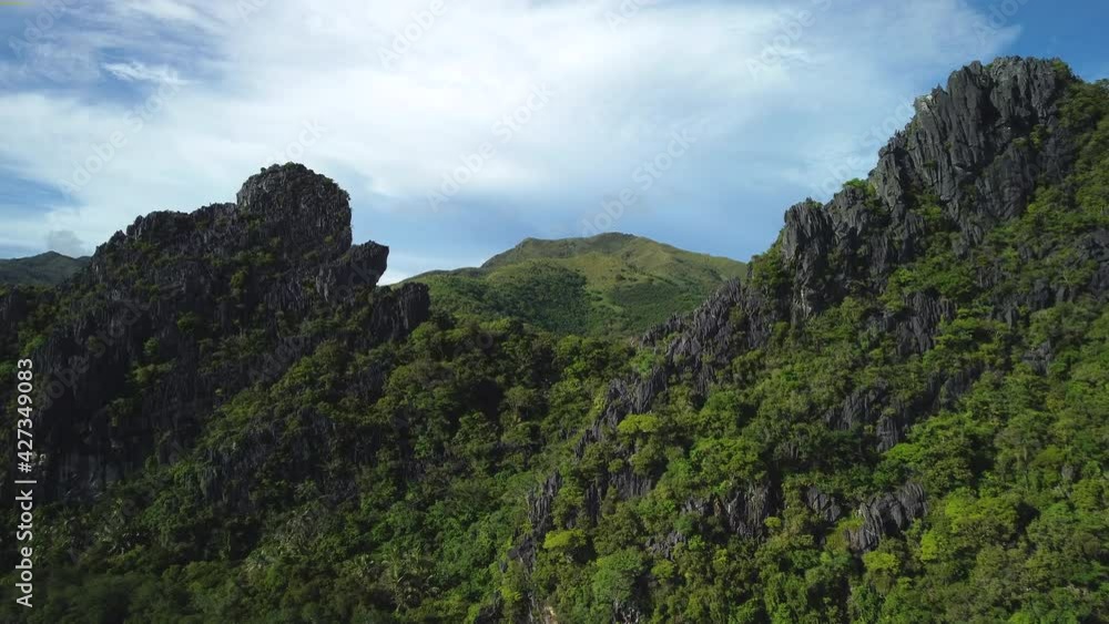 Aerial view over cliffs, revealing the Hienghene river, in Grande Terre, New Caledonia - rising, drone shot Aerial view over cliffs, revealing the Hienghene river, in Grande Terre, New Caledonia - rising, drone shot