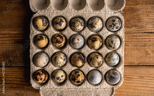 Quail eggs on the rustic background. Selective focus.