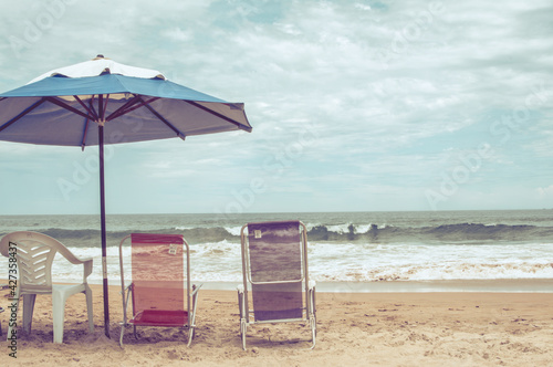 Fototapeta Naklejka Na Ścianę i Meble -  beach chairs and umbrella