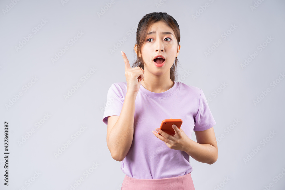 Young Asian woman using smartphone to brainstorm Young Asian woman using smartphone to brainstorm