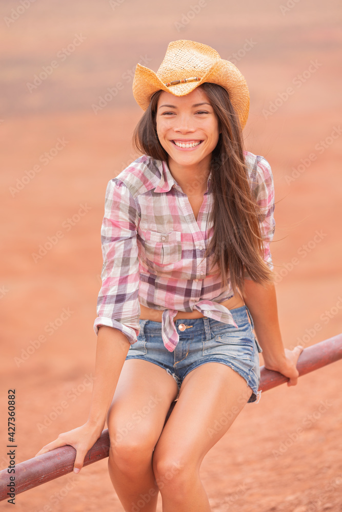Cowgirl Texas woman smiling happy on country farm ranch wearing cowboy ...