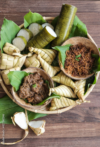 Fototapeta Naklejka Na Ścianę i Meble -  Traditional Malay food available during the fasting month / Popular Ramadan Food / Food like lemang, ketupat, palas, beef, or chicken rendang and serunding are commonly eaten together