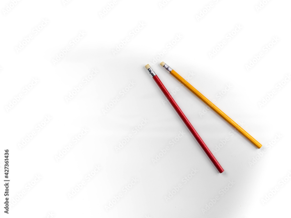 red and yellow pencils Placed on a white table, for taking notes of the meeting red and yellow pencils Placed on a white table, for taking notes of the meeting