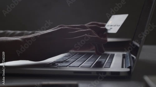 Online banking. Closeup view of person hands entering bank credit card data, typing on laptop's keyboard. E bank online payment. Internet shopping. Consumer paying for purchase in web store. 4k macro