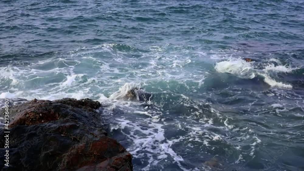 Sea wave crashing on the rocky reef Sea wave crashing on the rocky reef