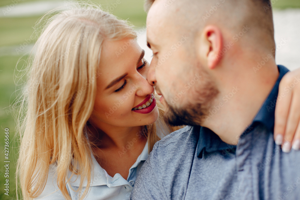 Beautiful couple spend time on a summer forest Beautiful couple spend time on a summer forest