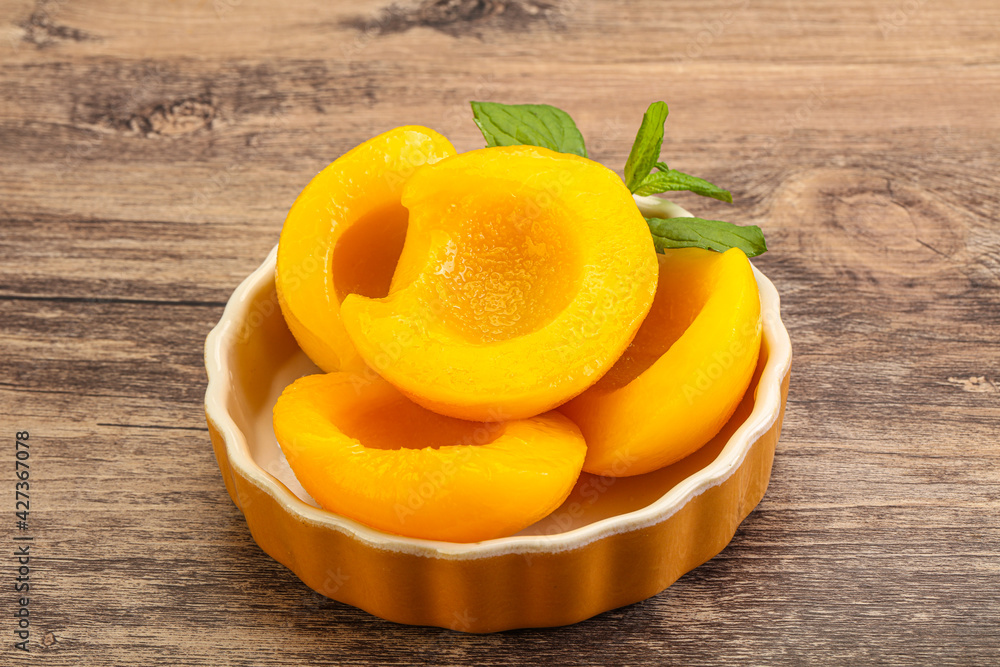 Sweet ripe canned peaches with mint Sweet ripe canned peaches with mint