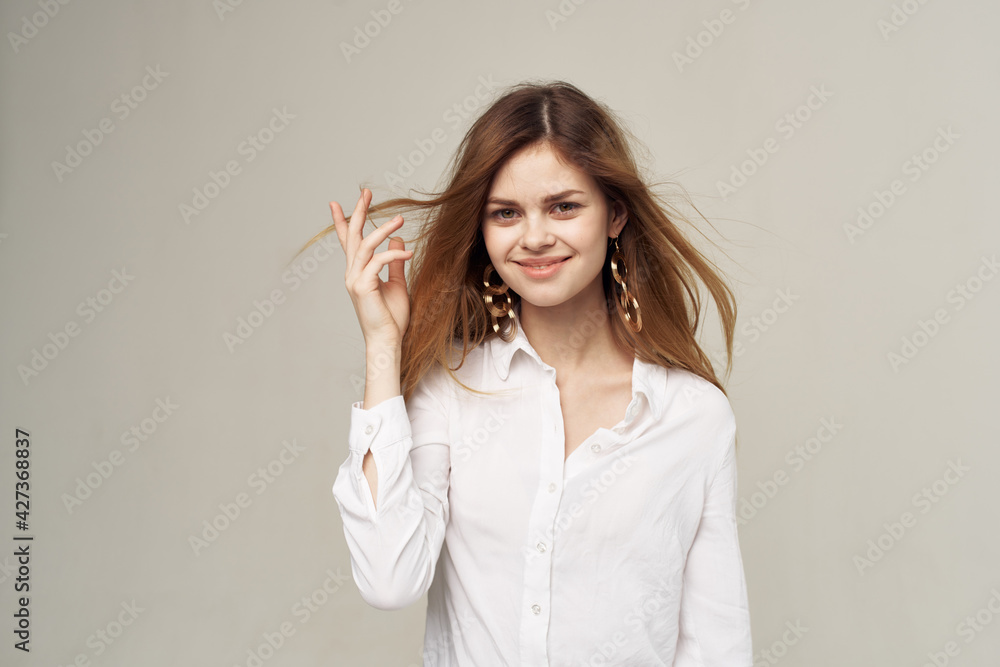 Attractive woman beautiful hair glamor white shirt fashion student light background Attractive woman beautiful hair glamor white shirt fashion student light background