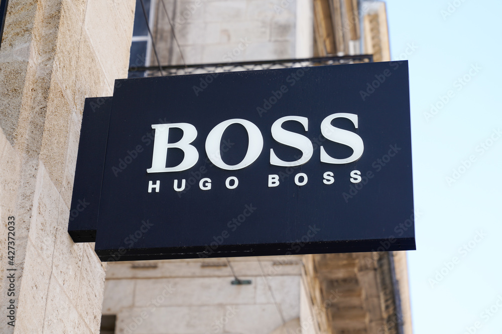 Hugo Boss logo brand and text sign on entrance shop luxury store of German  boutique fashion Stock Photo | Adobe Stock