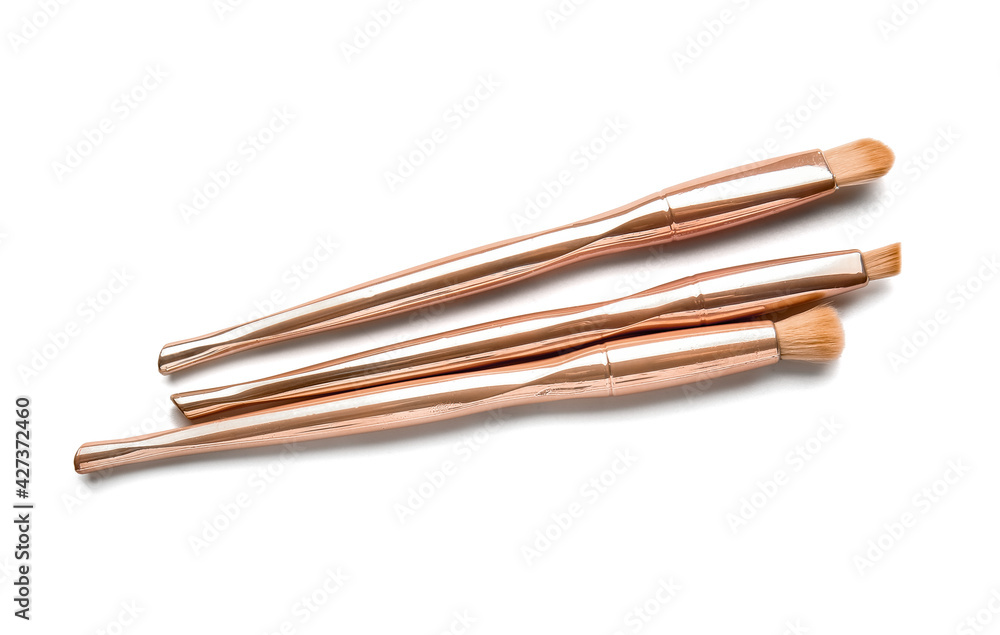 Stylish makeup brushes on white background Stylish makeup brushes on white background