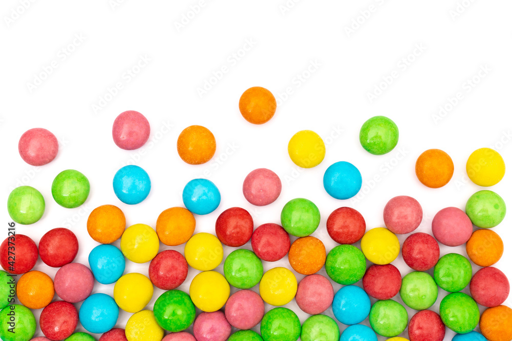 close up of colorful candies on white background with space for text. close up of colorful candies on white background with space for text.