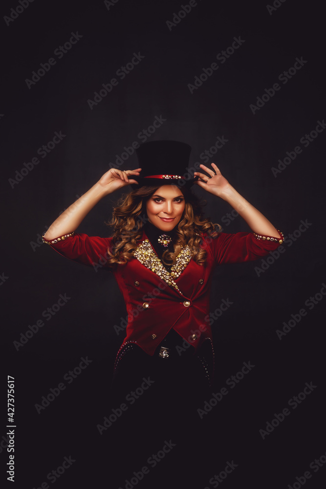 Female magician illusionist circus in theatrical clothes shows and