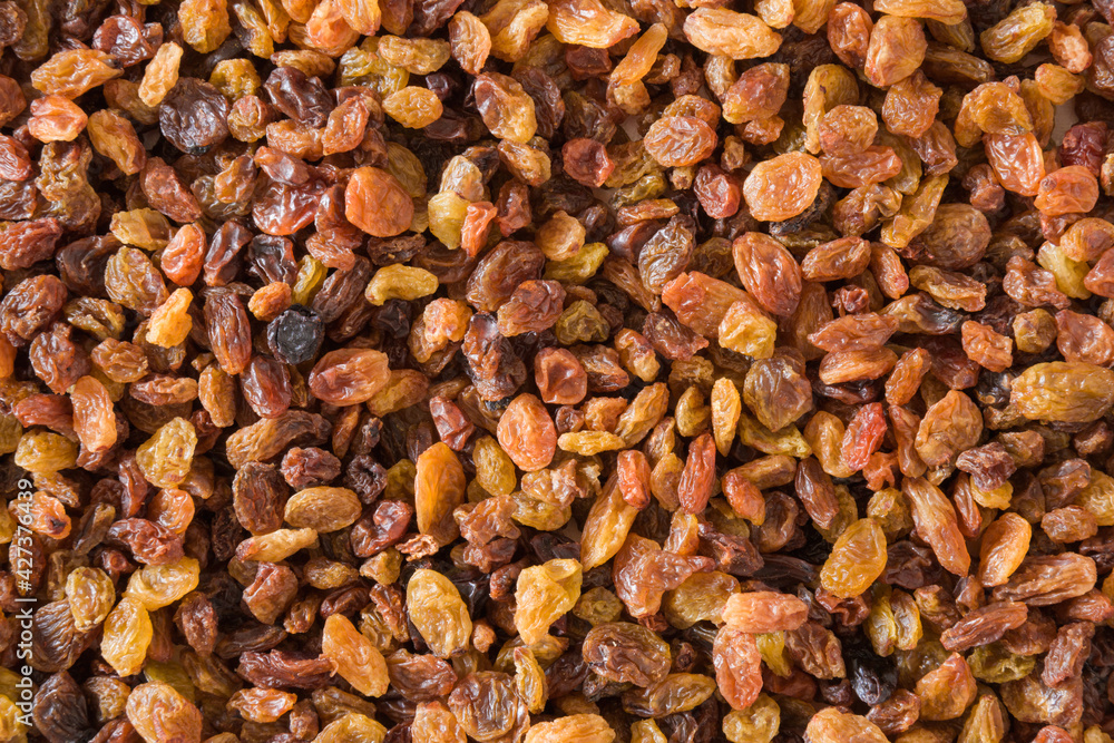 Different colorful raisins. Dried grapes. Healthy sweet food. Top down view. Different colorful raisins. Dried grapes. Healthy sweet food. Top down view.