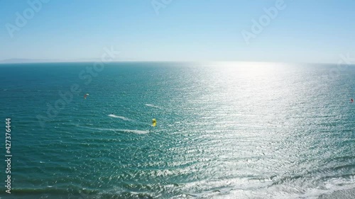 Group of kite surfers surfing at Seaside wilderness park in southern California