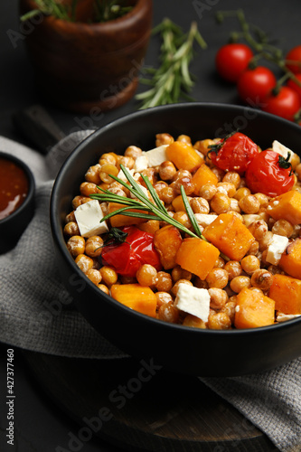 Delicious fresh chickpea salad on black table