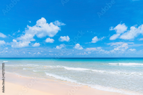 Beautiful tropical beach with blue sky and white clouds abstract texture background. Copy space of summer vacation and holiday business travel concept. © tonktiti