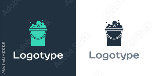 Logotype Bucket with soap suds icon isolated on white background. Bowl with water. Washing clothes, cleaning equipment. Logo design template element. Vector