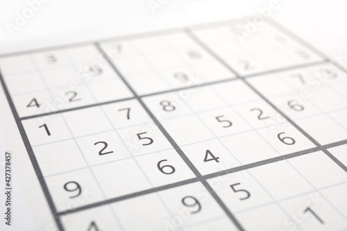 Sudoku puzzle grid as background, closeup view