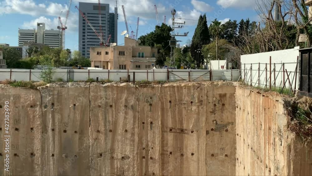 Pit for the construction of a multistory building, reinforced with the ...