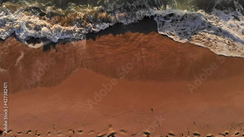 pull away shot on footprints on the shore of Miami Beach