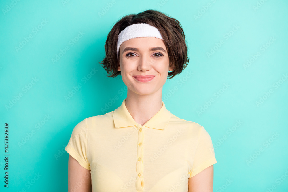 Photo of charming happy young woman smile good mood tennis player isolated on pastel teal color background Photo of charming happy young woman smile good mood tennis player isolated on pastel teal color background