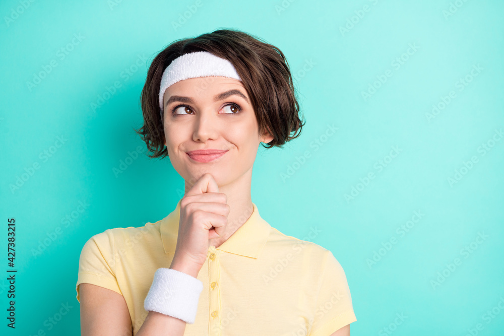 Portrait of attractive sportive bewildered cheerful girl thinking copy space clue guess isolated over bright teal turquoise color background Portrait of attractive sportive bewildered cheerful girl thinking copy space clue guess isolated over bright teal turquoise color background