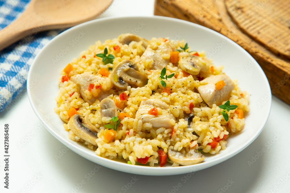 Traditional spanish paella tapa with chicken and vegetables. Traditional spanish paella tapa with chicken and vegetables.