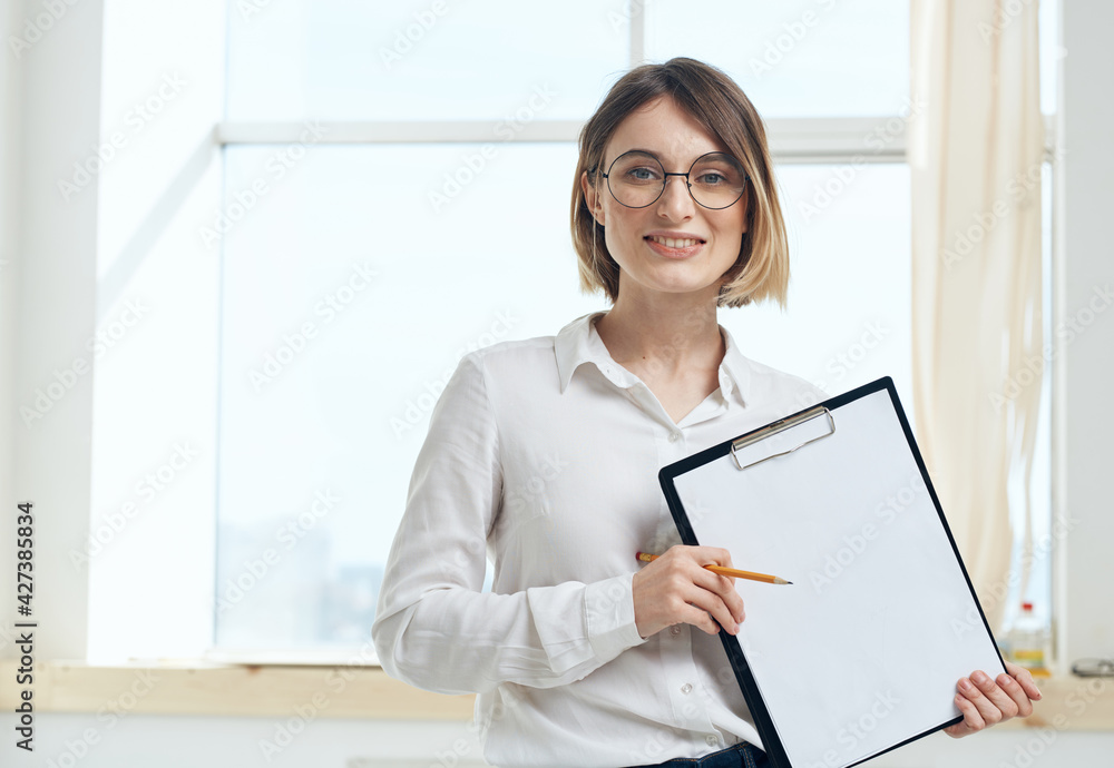 Woman rooming near window interior Folder with documents white sheet of paper Woman rooming near window interior Folder with documents white sheet of paper