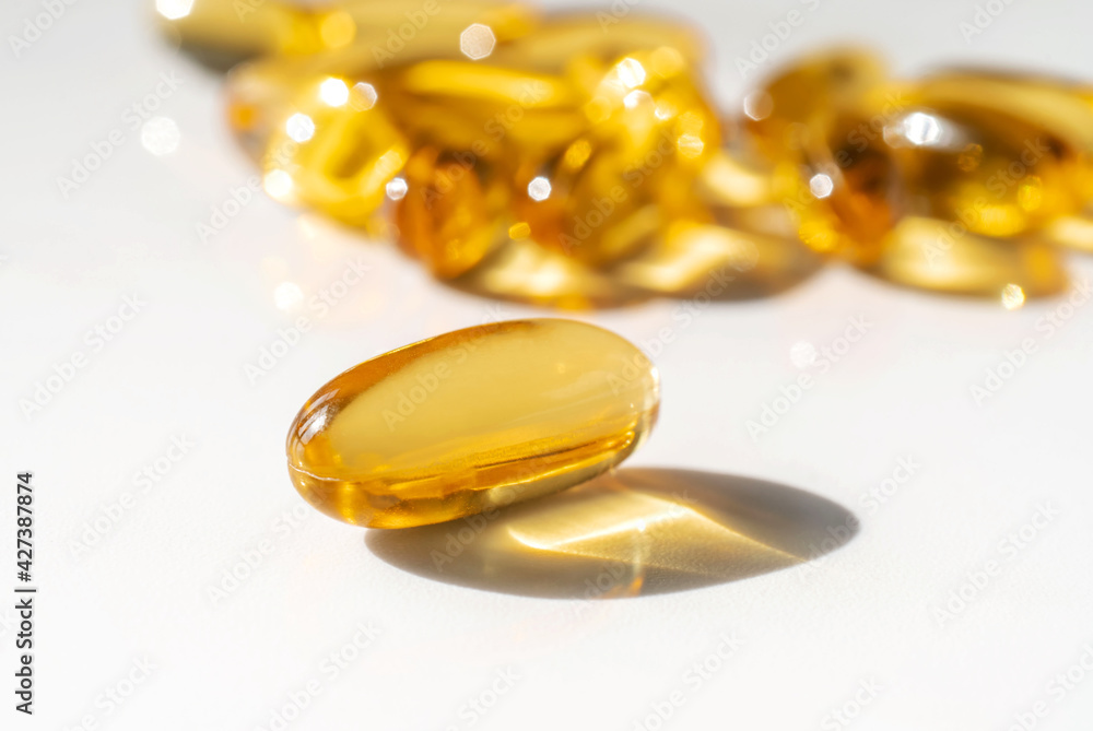 Oil filled capsules on the white background Oil filled capsules on the white background