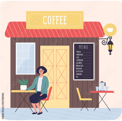 Small street cafe with menu board. Lady ordered coffee and waiting for waiter sitting on terrace