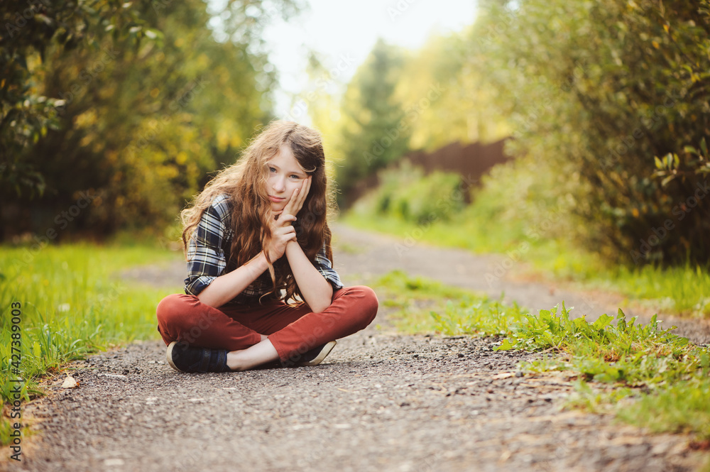 preteen 11 years old kid girl walking on summer countryside road, enjoying vacations outdoor preteen 11 years old kid girl walking on summer countryside road, enjoying vacations outdoor