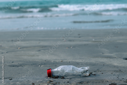 plastic water bottle in the beach that pollution environment  of the ocean (Environment Concept)
