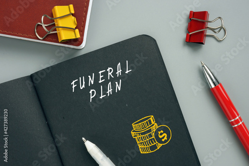  FUNERAL PLAN sign on the piece of paper. A Funeral Plan is an easy way to pre-arrange the funeral you want and pay for the funeral director's services at today's prices