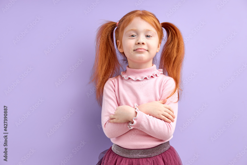 human emotions, reactions and feelings. moody displeased little girl crossing arms on her chest, having offended facial expression human emotions, reactions and feelings. moody displeased little girl crossing arms on her chest, having offended facial expression