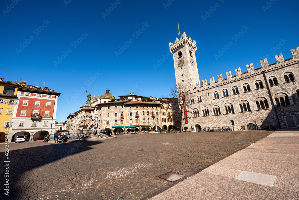 Cathedral Square in Trento downtown (Piazza del Duomo) with the Neptune fountain, Civic tower, Praetorian Palace and the frescoed houses Cazuffi Rella. Trentino Alto Adige, Italy, Europe.