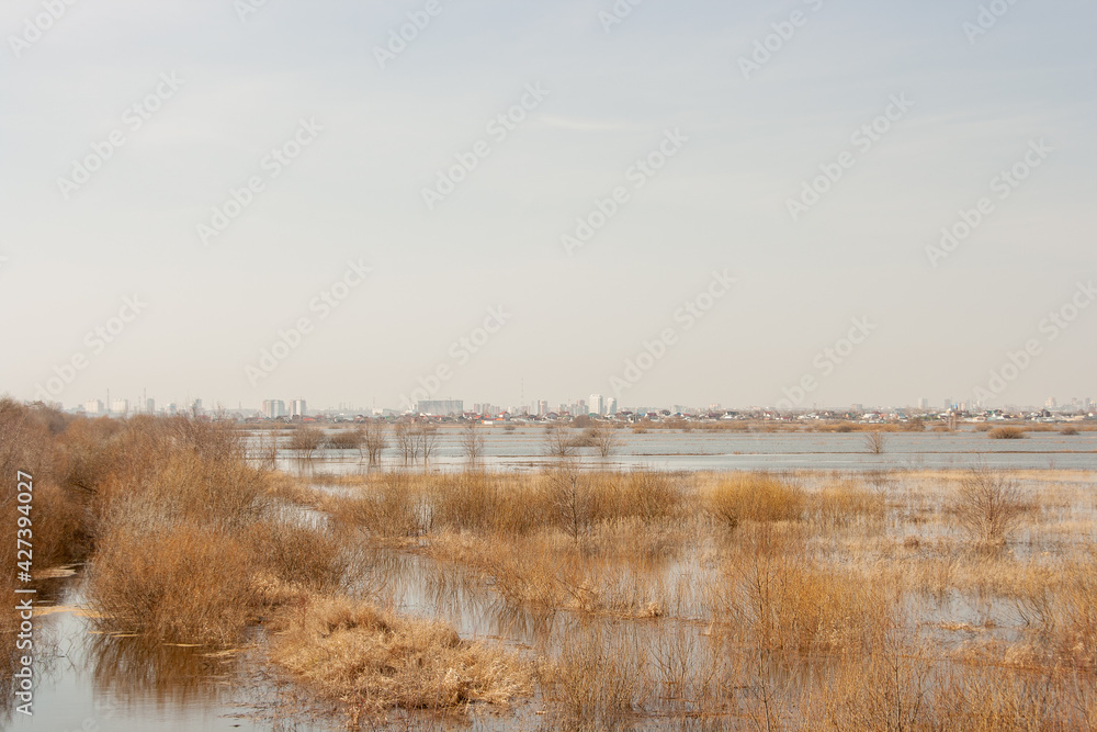 Flooded meadows of the Oka River with a view of the village of Shumash and the city of Ryazan in April