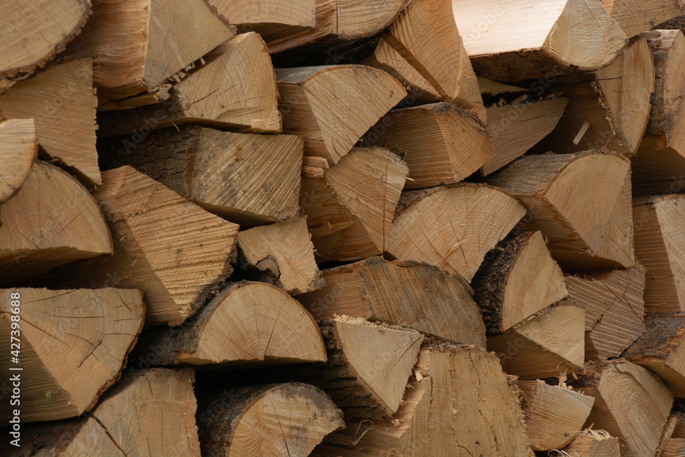 Background of fresh chopped firewood logs in a pile Background of fresh chopped firewood logs in a pile