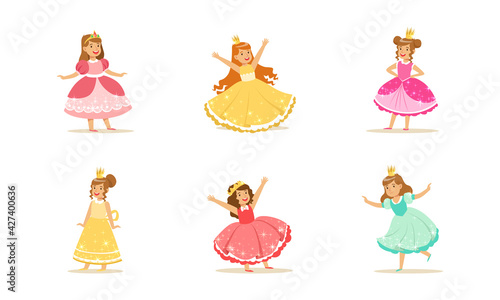 Cute Girls in Princess Dresses Set, Princesses with Crowns in Elegant Colorful Evening Gowns Cartoon Vector Illustration