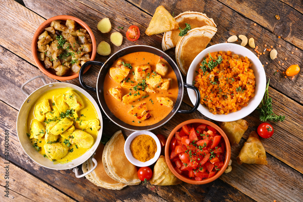 assorted indian food - naan, curry chicken, dhal lentil and rice assorted indian food - naan, curry chicken, dhal lentil and rice