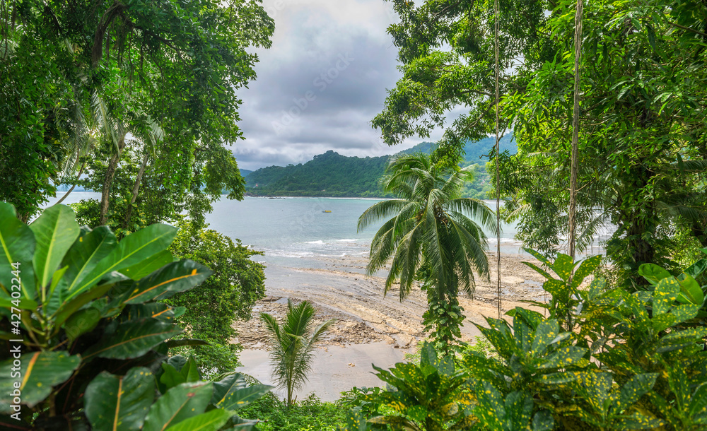 Mountainous, tropical, beautiful green nature in Costa Rica with the ocean. Central America. Mountainous, tropical, beautiful green nature in Costa Rica with the ocean. Central America.