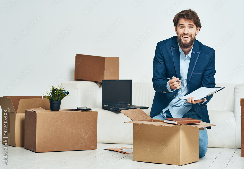 A man collects things in a firing box moving to an office A man collects things in a firing box moving to an office
