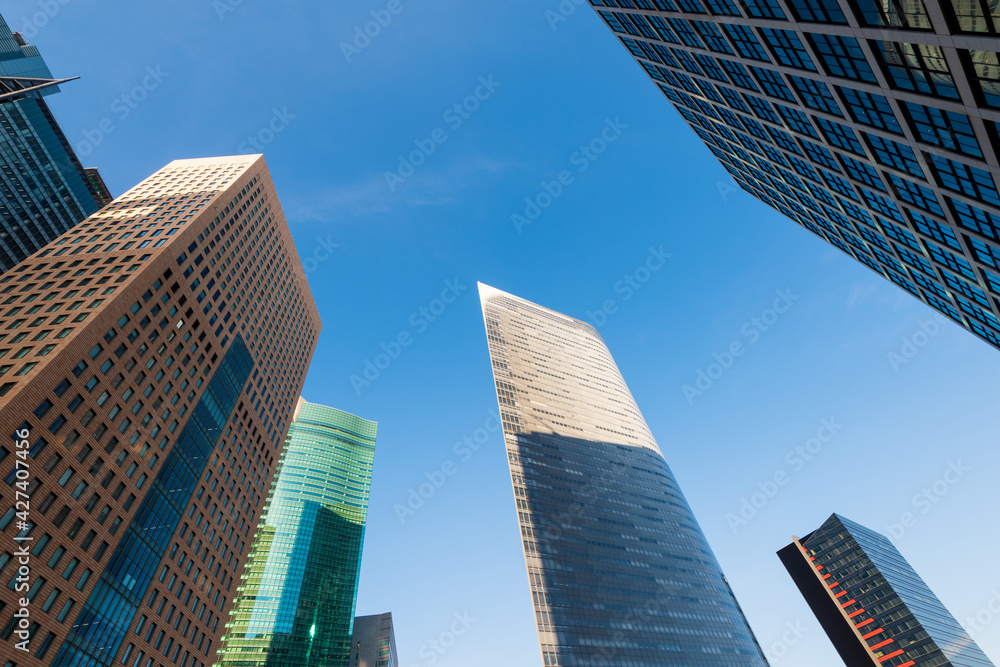 Modern Office buildings and blue sky. Japan, Shinjuku Ward, Shiodome, Tokyo. Shiodome, a redeveloped business and leisure district near Tokyo Bay.