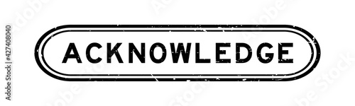 Grunge black acknowledge word rubber seal stamp on white background