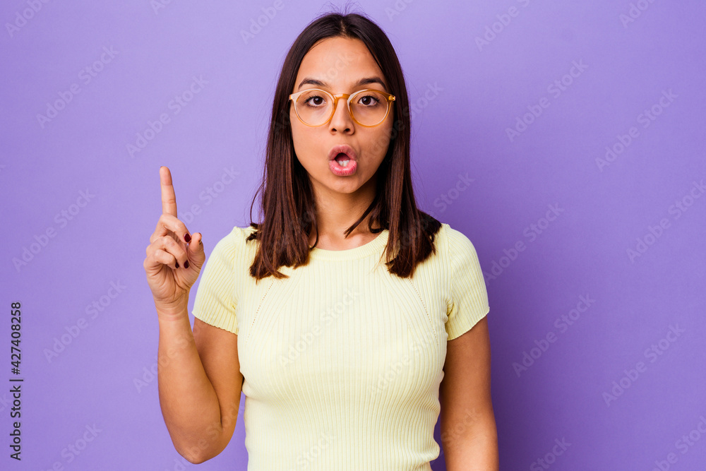 Young mixed race woman isolated having some great idea, concept of creativity. Young mixed race woman isolated having some great idea, concept of creativity.