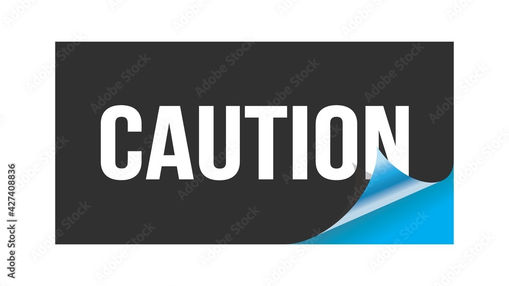 CAUTION text written on black blue sticker. CAUTION text written on black blue sticker.
