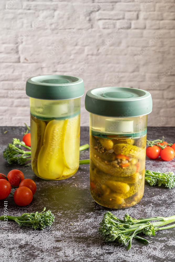 Retro food photography of a press jars with homemade fermented pickles and vegetables. Still life image with a vintage look. Retro food photography of a press jars with homemade fermented pickles and vegetables. Still life image with a vintage look.